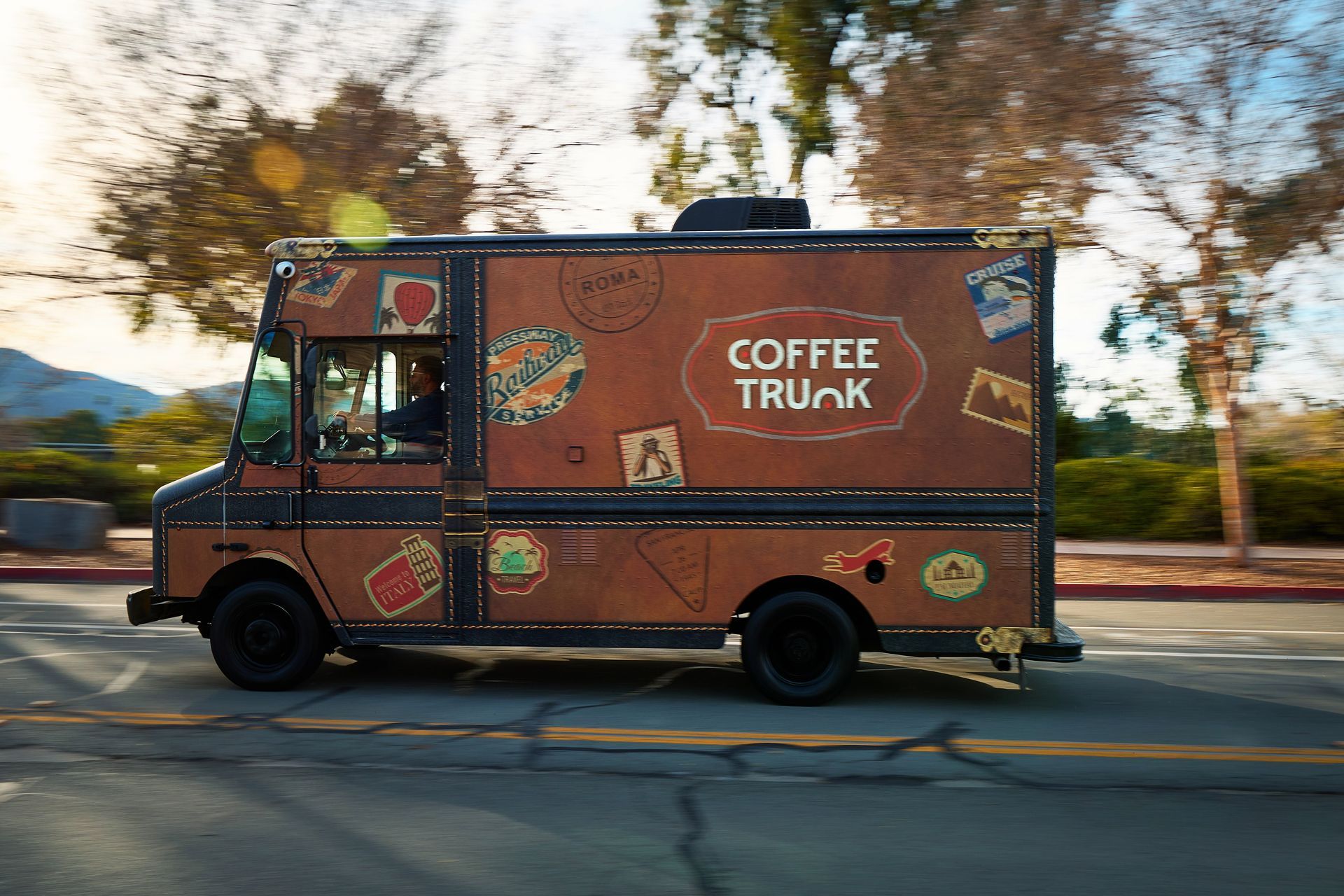 Sleek Coffee Trunk truck spotted on a scenic coastal road