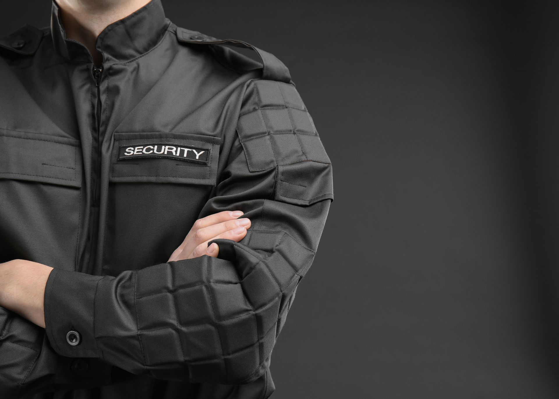 Close-up of a commercial security guard service professional in high-quality protective gear.