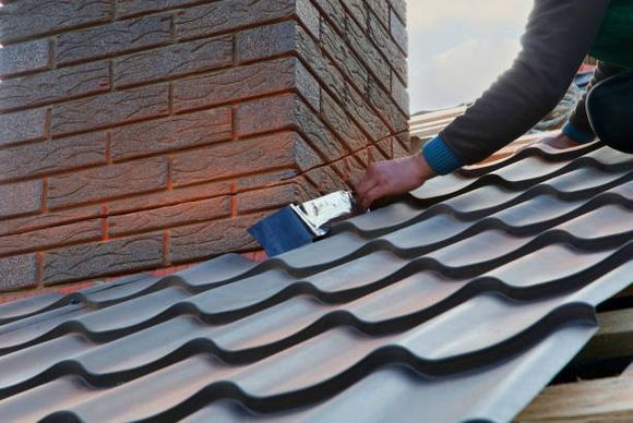 Roofer Builder Worker Attach Metal Sheet to the Chimney — Smallwood, NY — Liberty Chimney & Sons