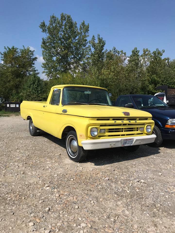 yellow Ford pickup truck