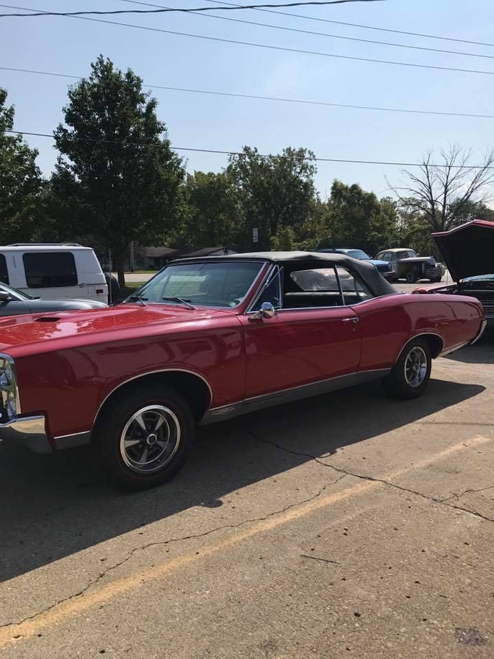 red convertible in parking lot