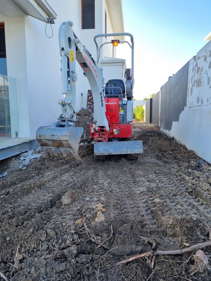 A Kobelco Machine Is Digging A Hole In The Ground - Mini Earth Works & Excavation on the Gold Coast, QLD