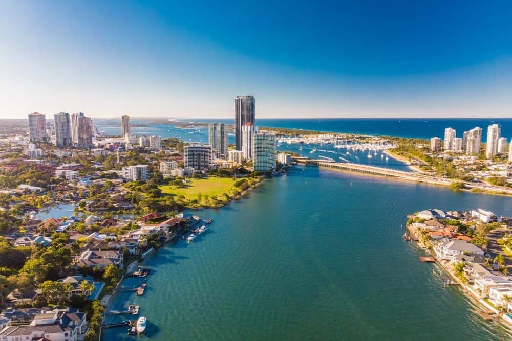 An Aerial View Of A City With A River Running Through It - Mini Earth Works & Excavation on the Gold Coast, QLD