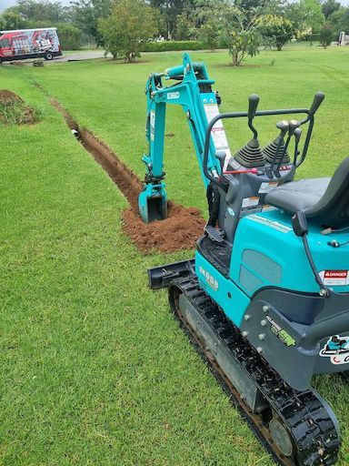 A Blue Excavator With The Word Kobelco On It - Mini Earth Works & Excavation on the Gold Coast, QLD