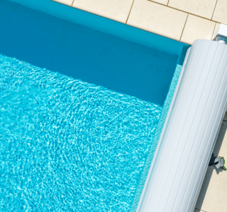 Picture of rolled up pool cover.