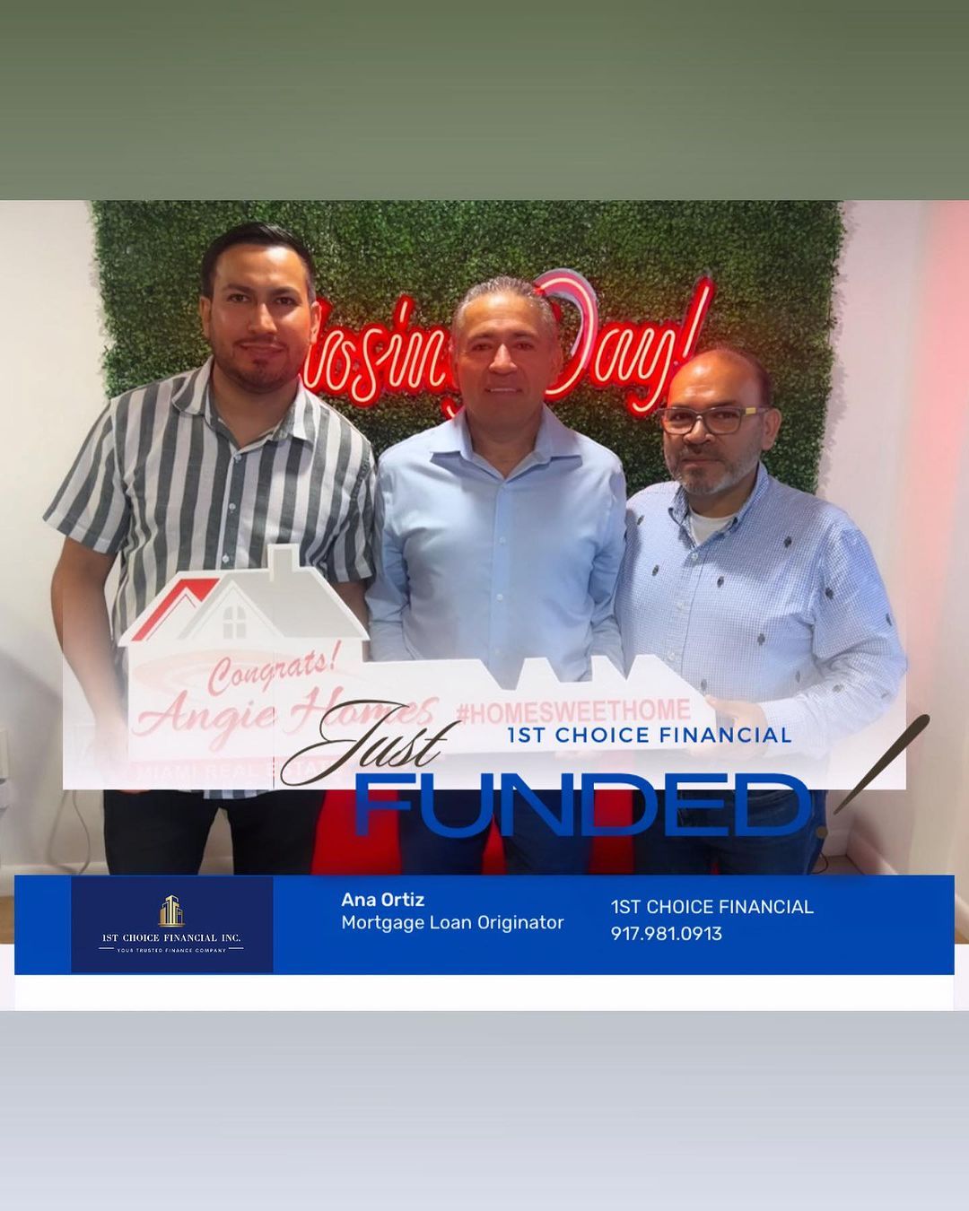 Three men pose for a photo celebrating a home closing. A neon sign reads “Closing Day!”