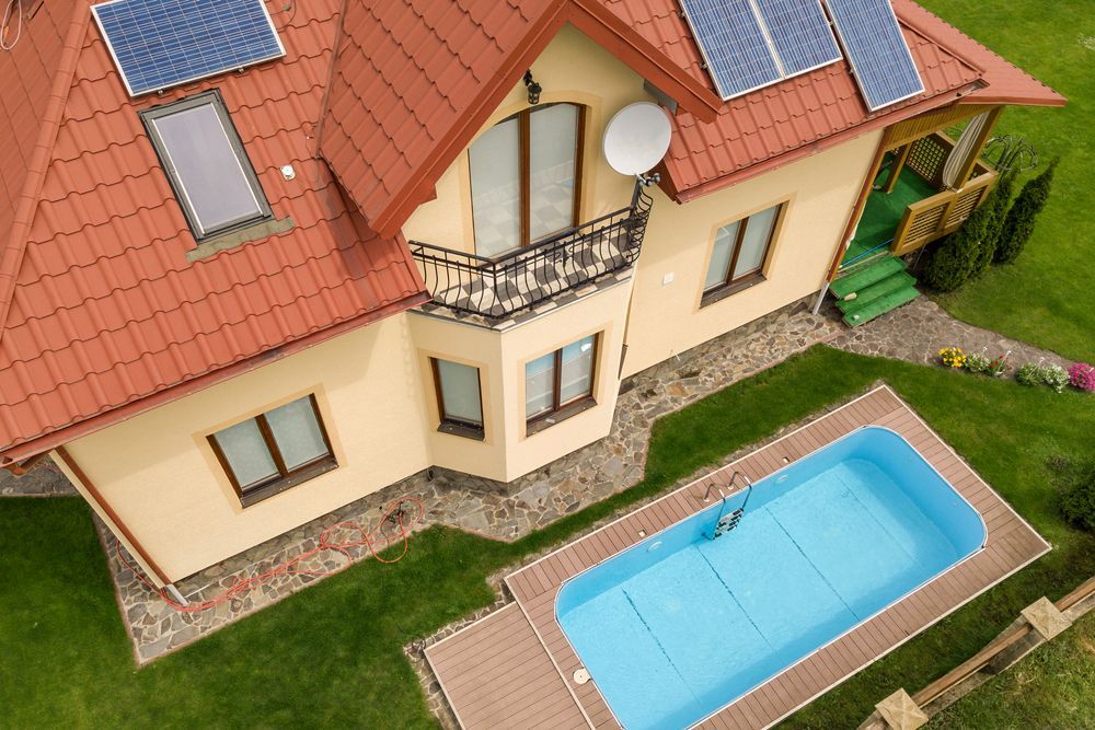 House With Red Tile Roof, Solar Panels — Bombs Away Pools in Coolangatta, QLD