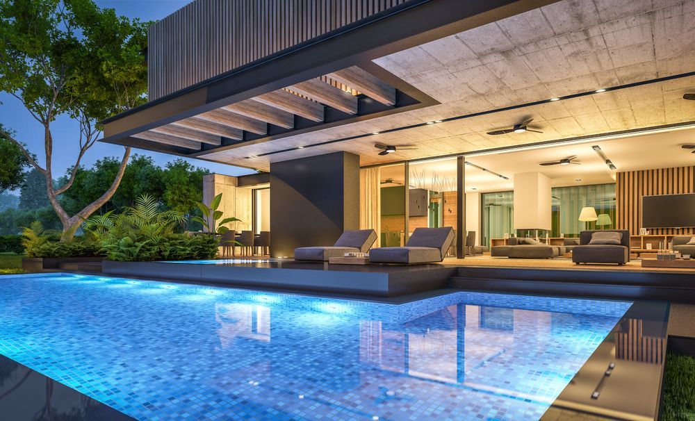 Luxurious Modern Home With Pool, Open-air Patio, and Evening Lights Reflecting in the Water — Bombs Away in Broadbeach, QLD