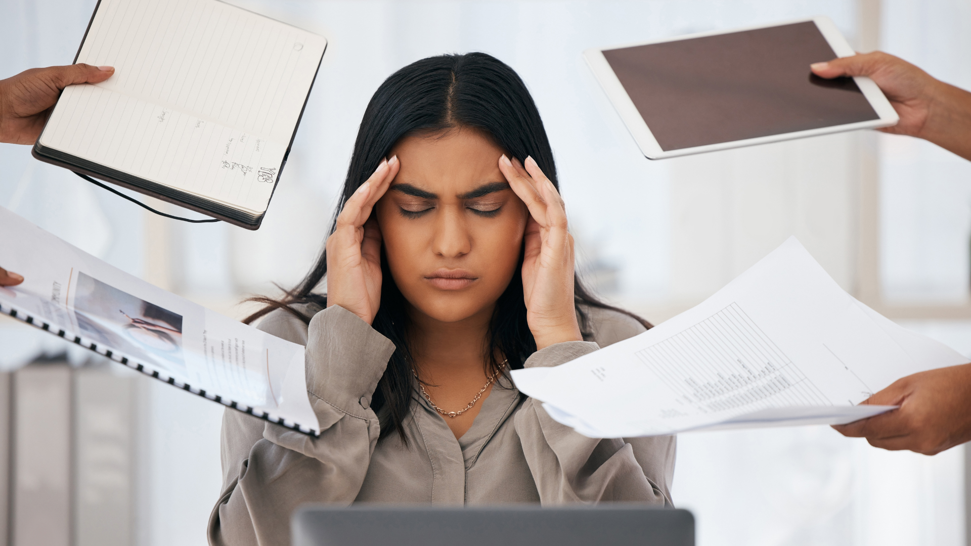 Employee feeling burn out at her desk