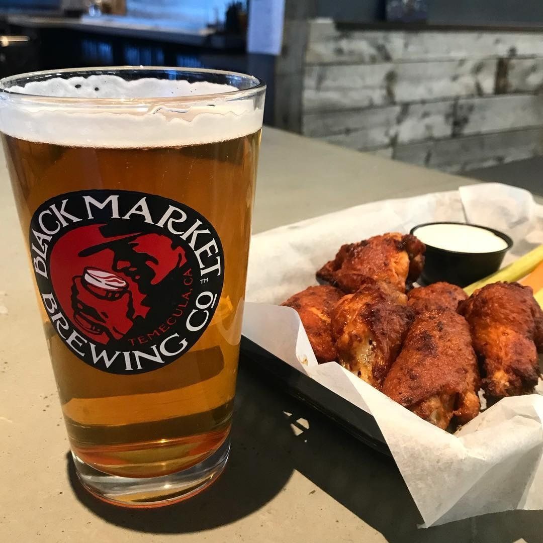 Beer and chicken wings on a plate