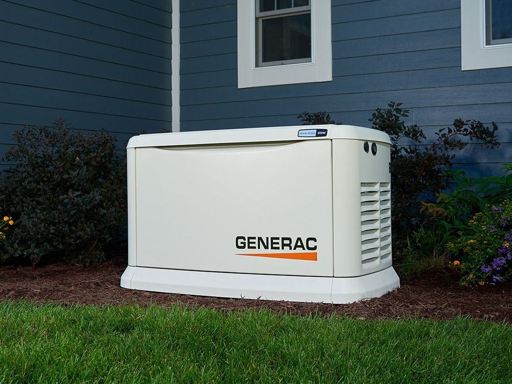 A generac generator is sitting outside of a house