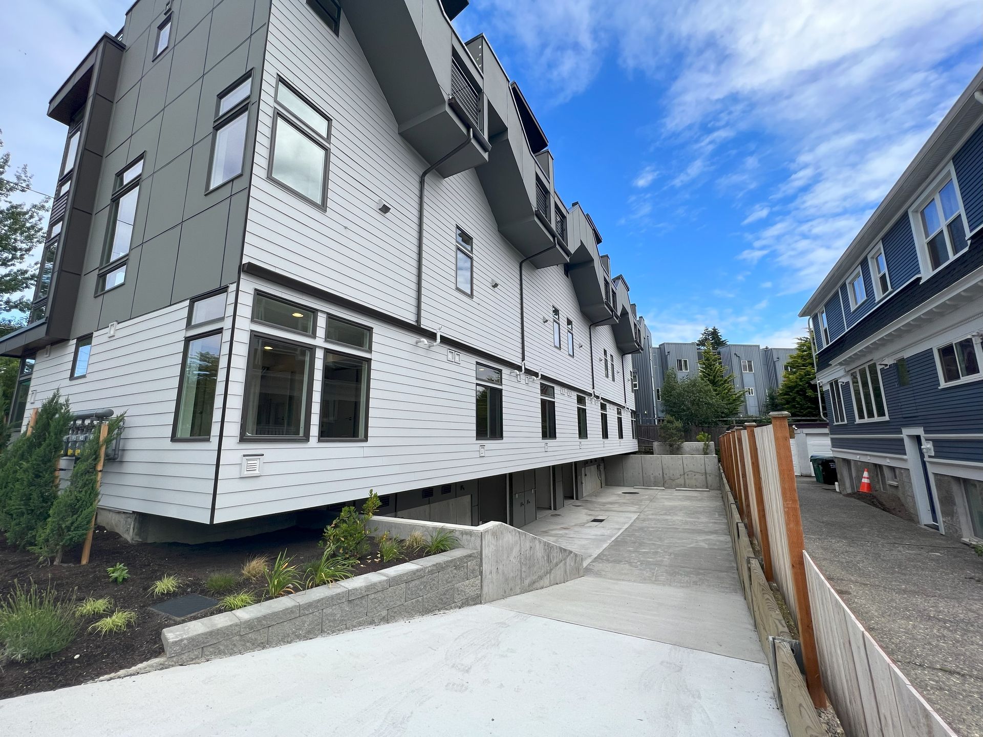 A building with a lot of windows and a fence in front of it