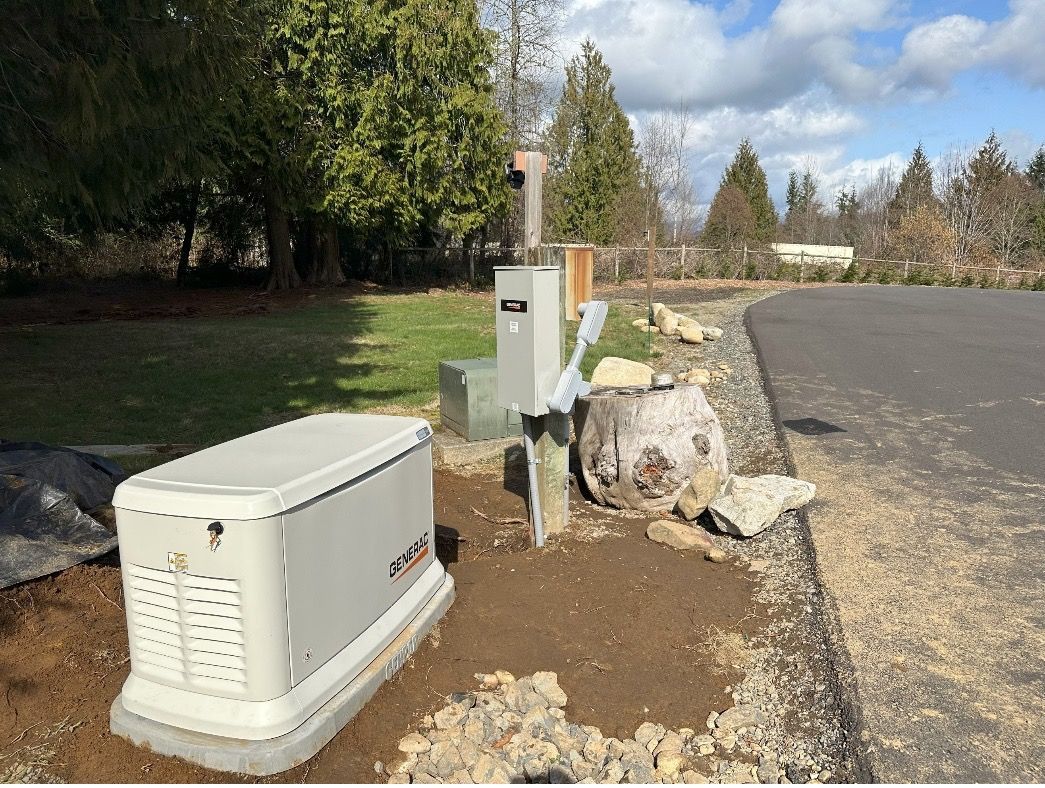 a generator is sitting on the side of the road next to a mailbox .