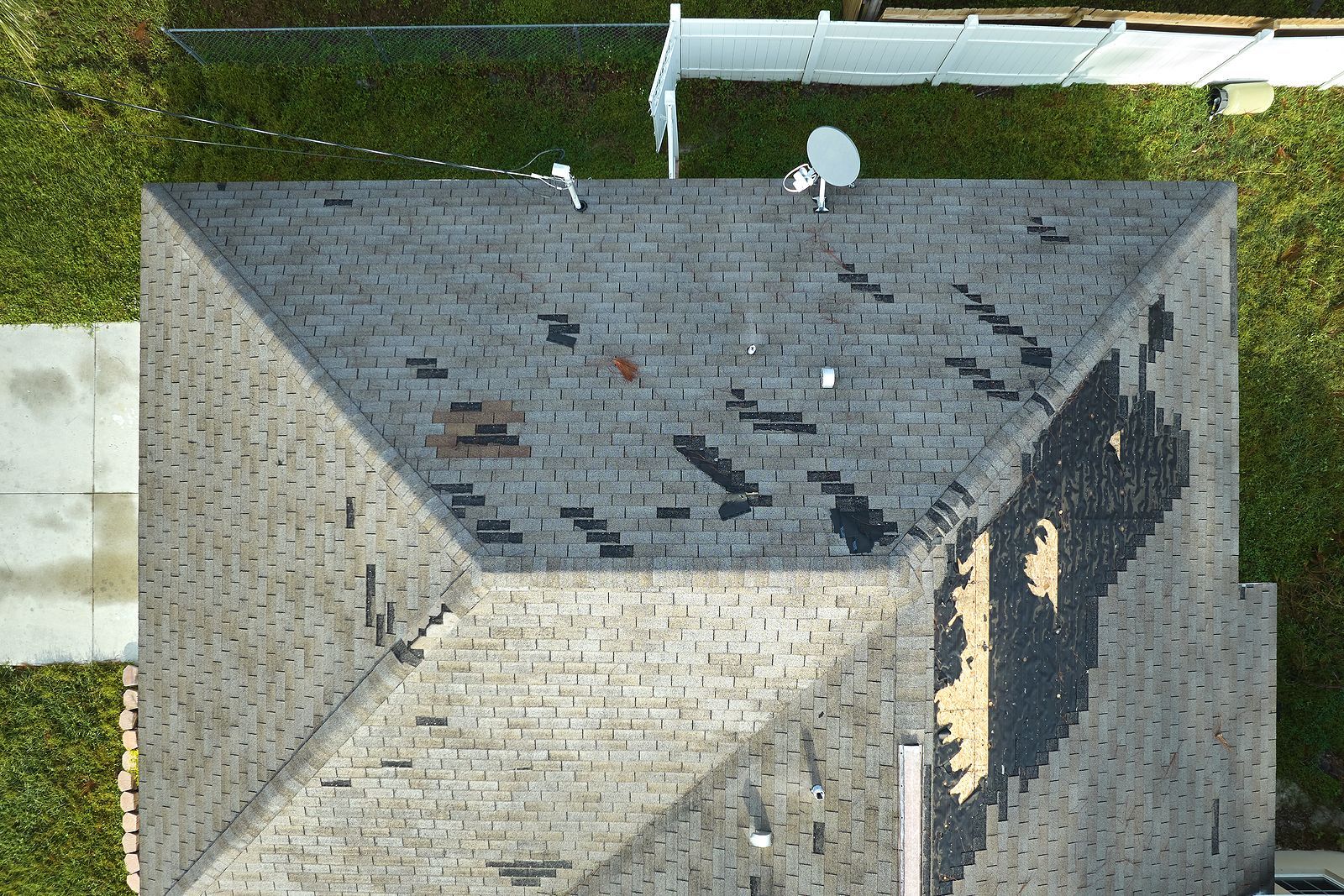 An aerial view of a roof with a satellite dish on top of it