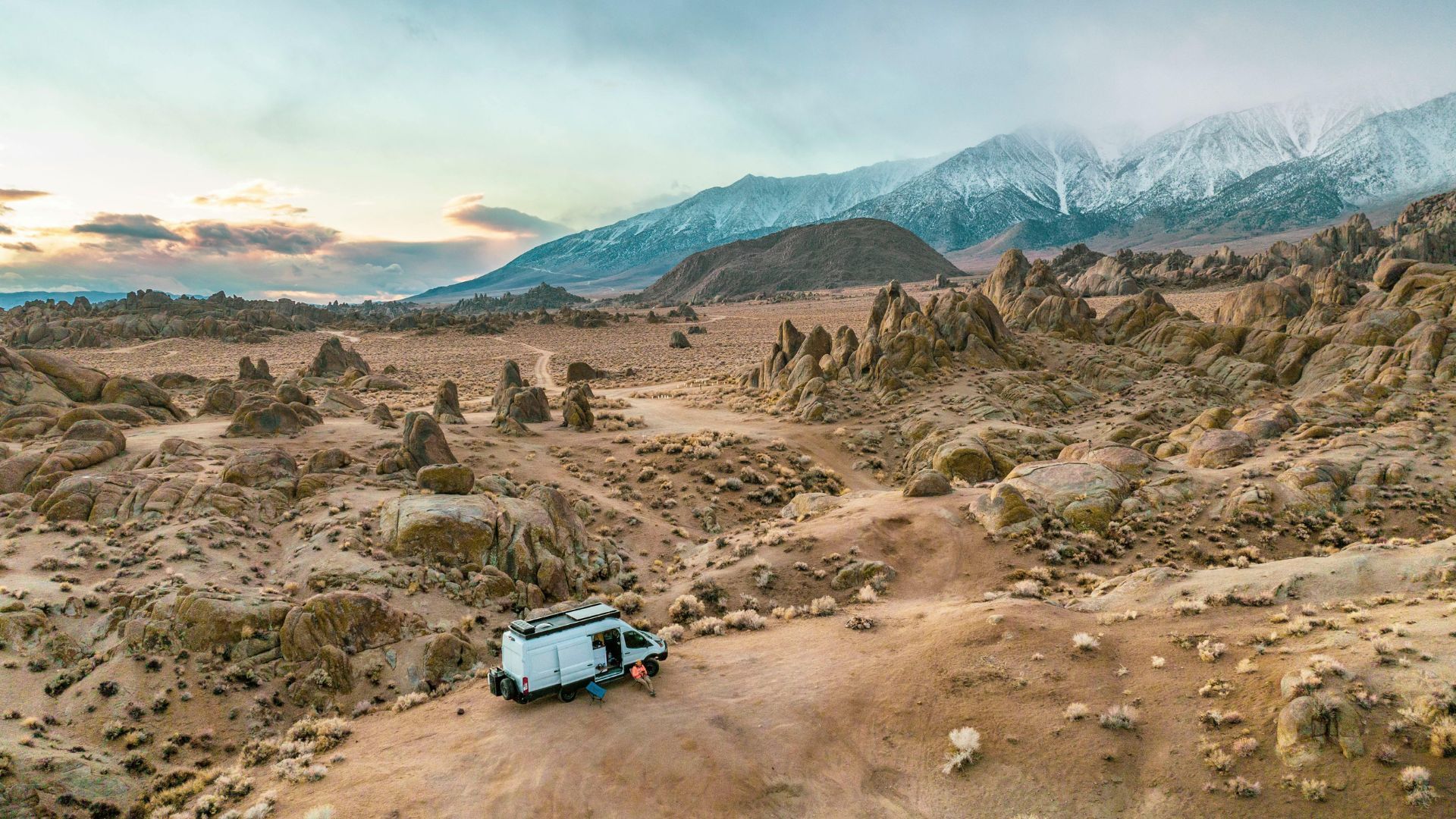 People swimming on a beach in Malta surrounded by cliffs