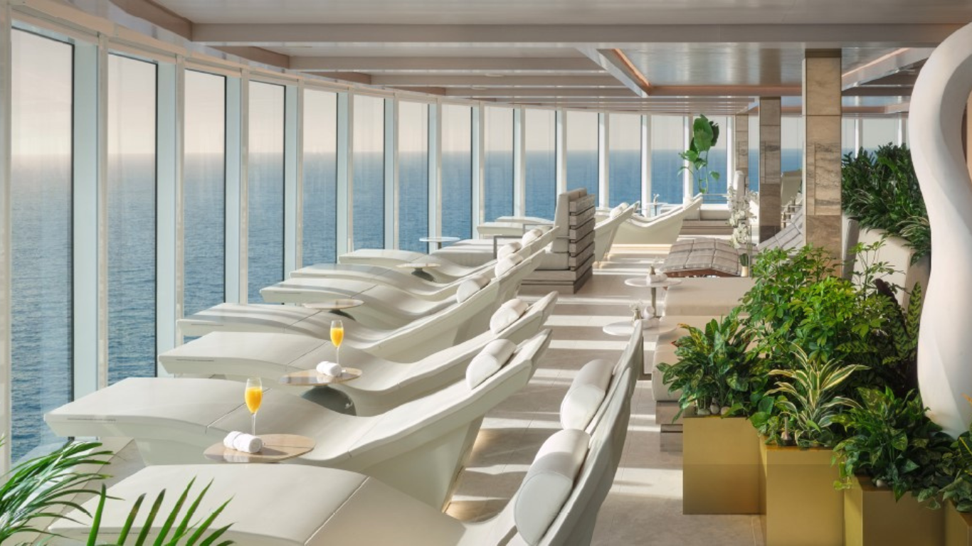 A picture of the inside of a spa with multiple lounge chairs and drinks served on the side. Part of Norwegian Cruise Line 