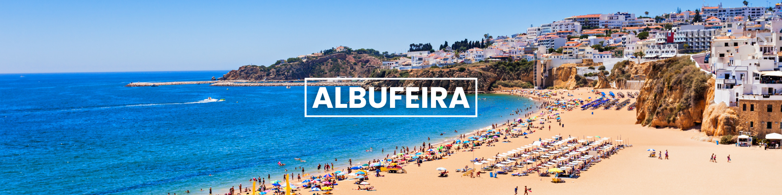 a beach in albufeira with a lot of people on it Barter'sTravelnet