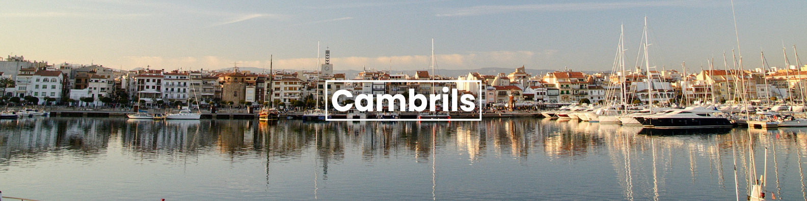 a blurry picture of a harbor with the words cambrils on the bottom Barter's Travelnet 