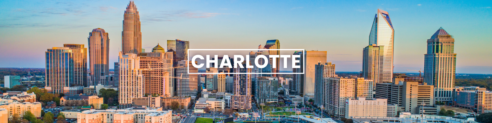 an aerial view of the city skyline of charlotte , north carolina . Barter's Travelnet 