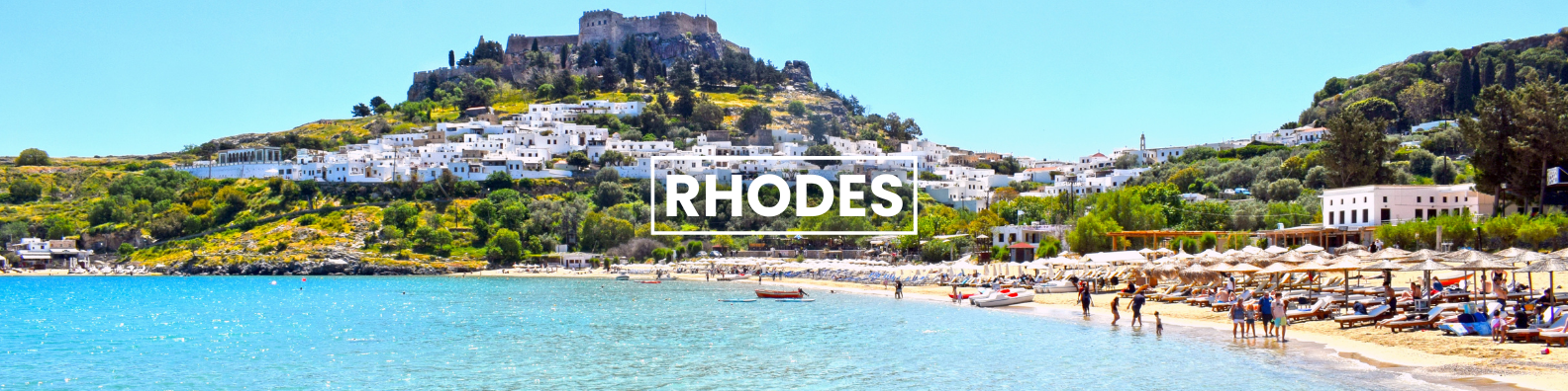 a beach in rhodes with a mountain in the background .Barter'sTravelnet