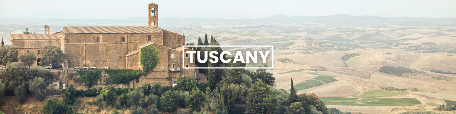  an aerial view of a castle on top of a hill in tuscany . Barter'sTravelnet
