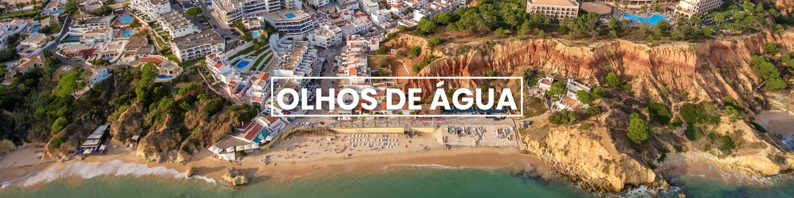 an aerial view of a beach with the words olhos de agua written on it . Barter's Travelnet