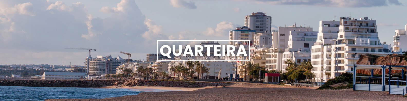 a blurry picture of a city with the word quarteira on it . Barter's Travelnet 
