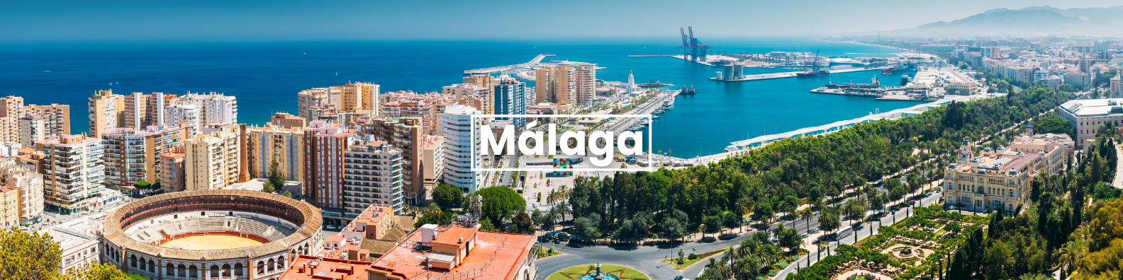 an aerial view of the city of malaga with the ocean in the background . Barter's Travelnet
