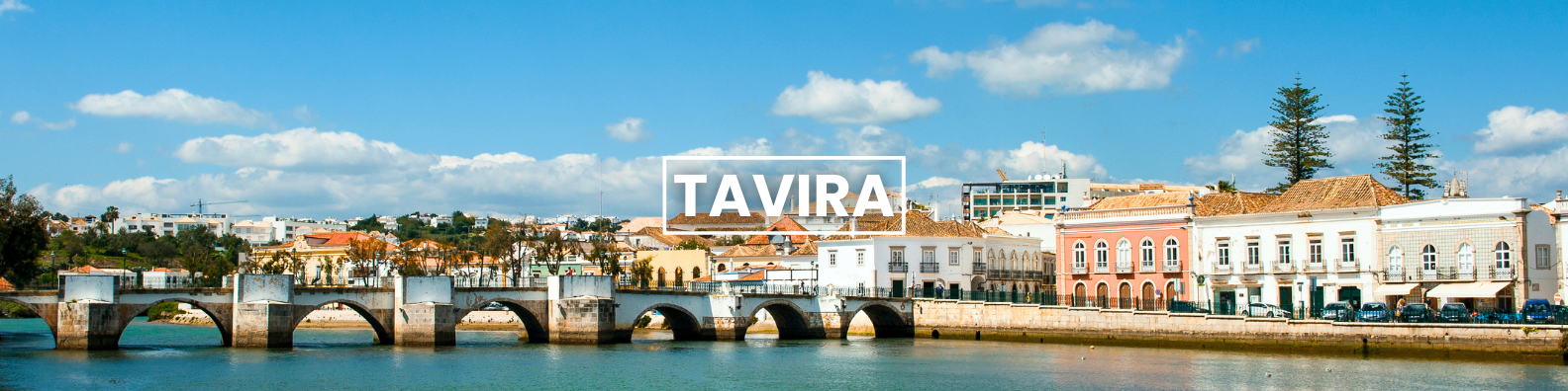 a bridge over a body of water with a city in the background Barter's Travelnet 