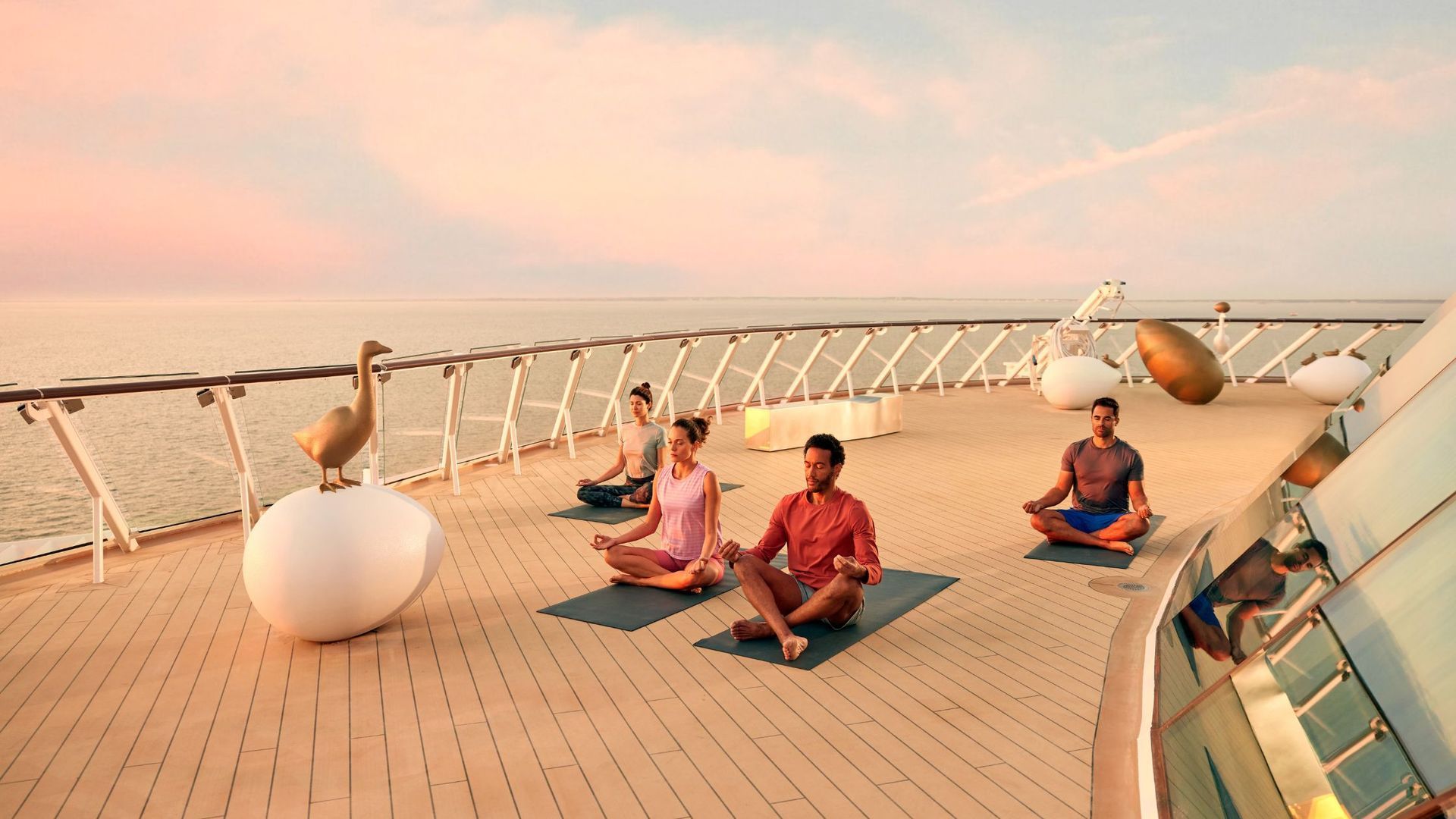 A group of people are doing yoga on a cruise ship.