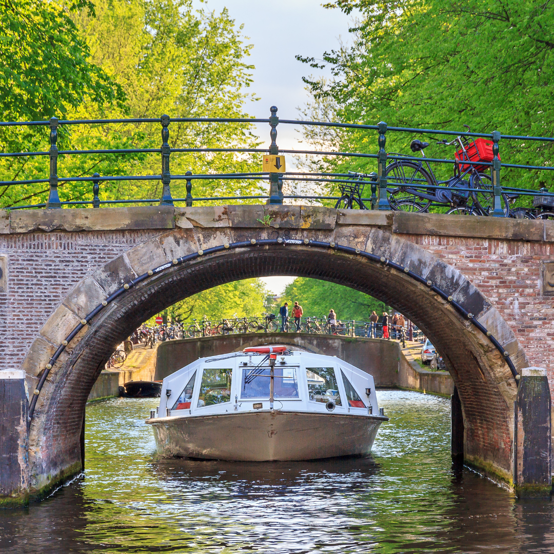 Boat Under Bridge Amsterdam Canal Cruise, Netherlands - Amsterdam Holidays Barter's Travelnet
