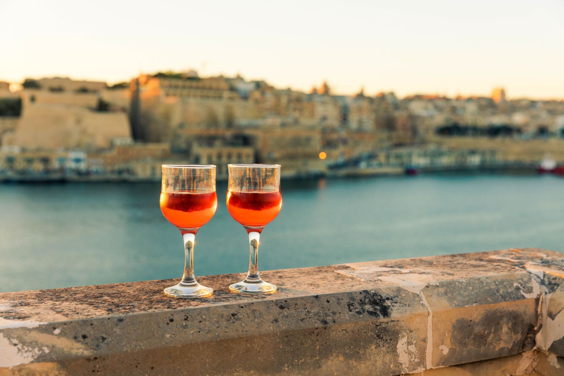 2 drinks overlooking the sea in malta