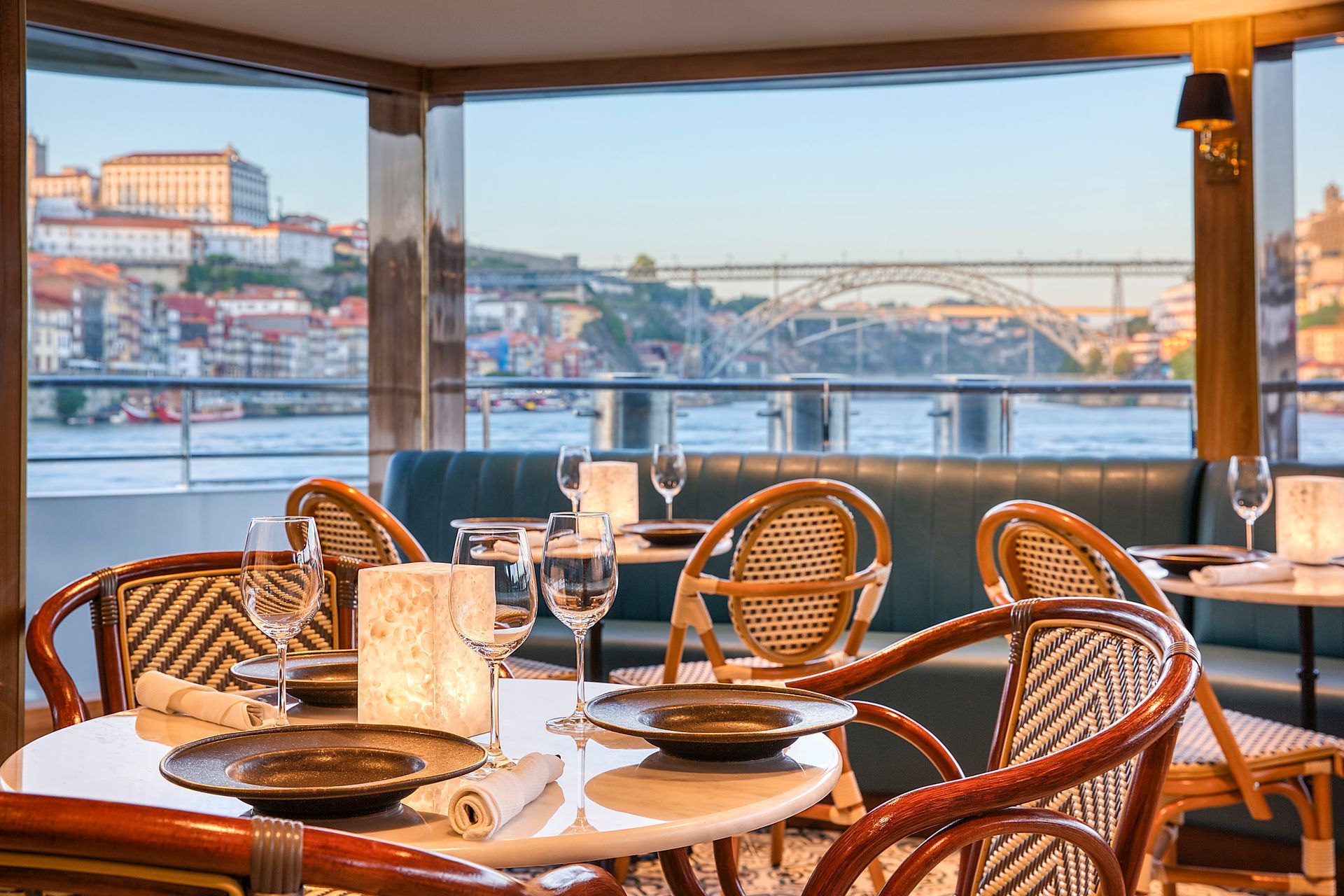 A restaurant with tables and chairs and a view of the water SS São Gabriel River Cruise Uniworld Barter's Travelnet