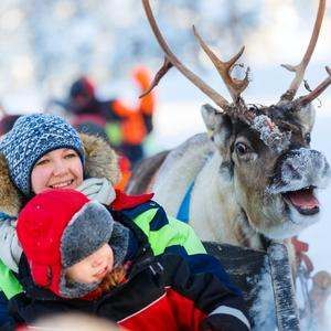Two Kids with a Meyazia Reindeer in Lapland - Family Holidays Barter's Travelnet