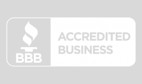 A white badge that says accredited business on it