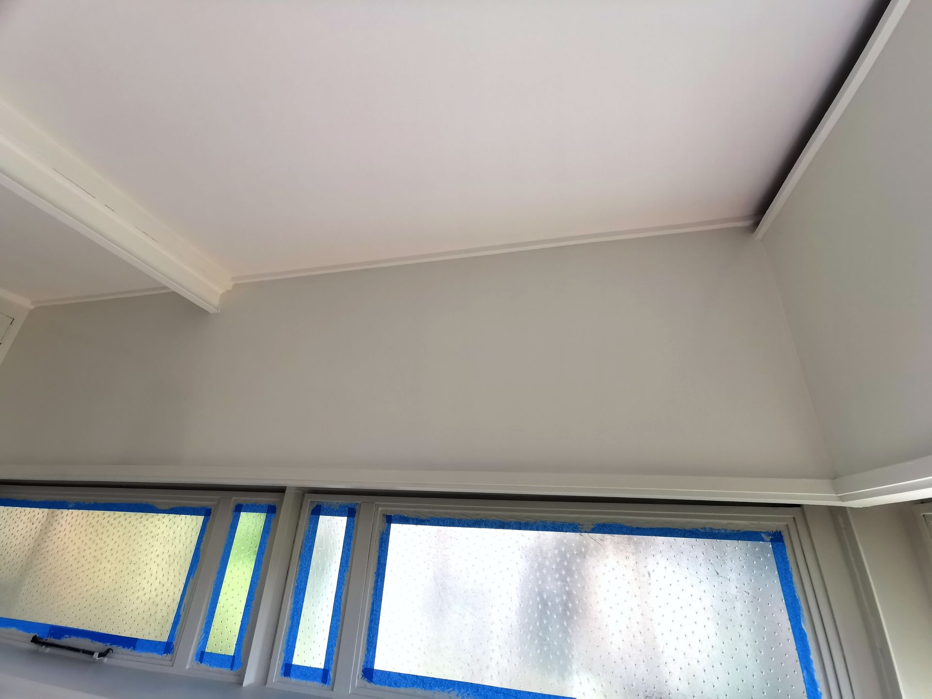 A Window With Blue Tape On It And A White Ceiling — Hornsby, NSW — TOG Painting