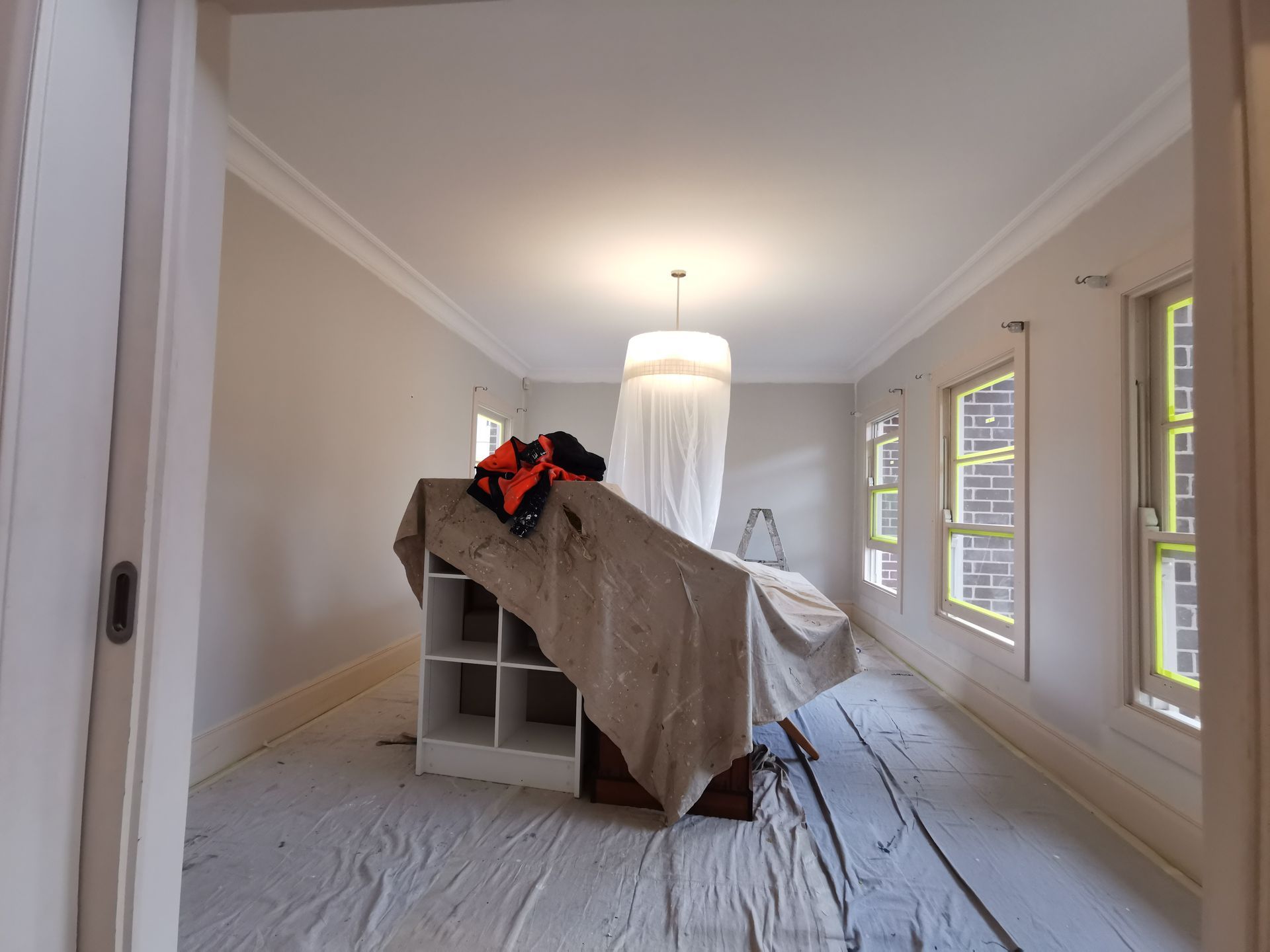 An Empty Room With A Shelf And A Chandelier — Hornsby, NSW — TOG Painting