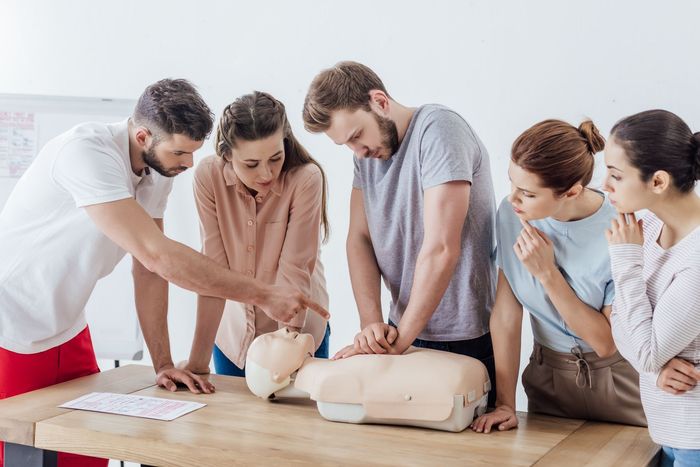 Group of People Practicing CPR