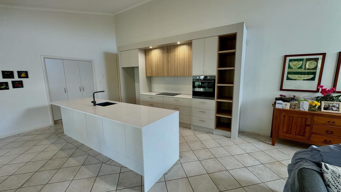 A kitchen with a large island in the middle of the room — Coastal Detail Joinery in Tuncurry, NSW