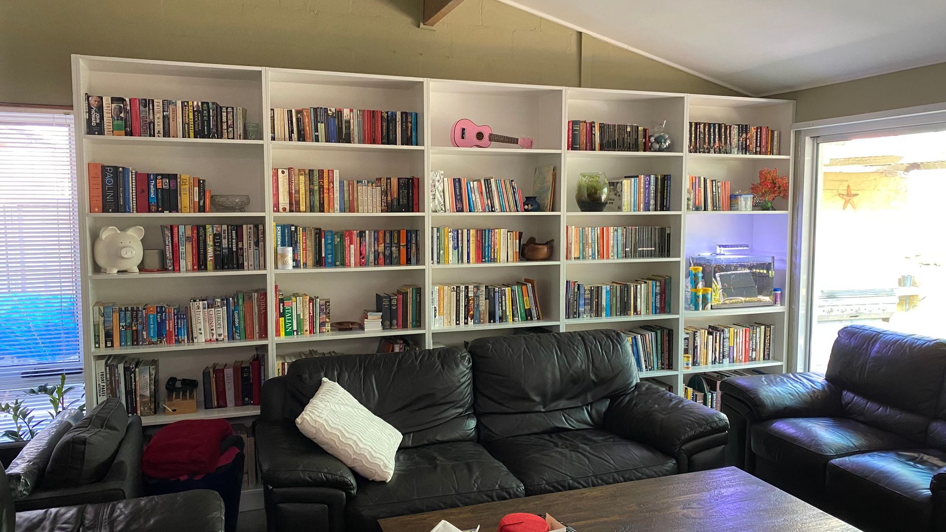 A living room filled with furniture and bookshelves — Coastal Detail Joinery in Tuncurry, NSW