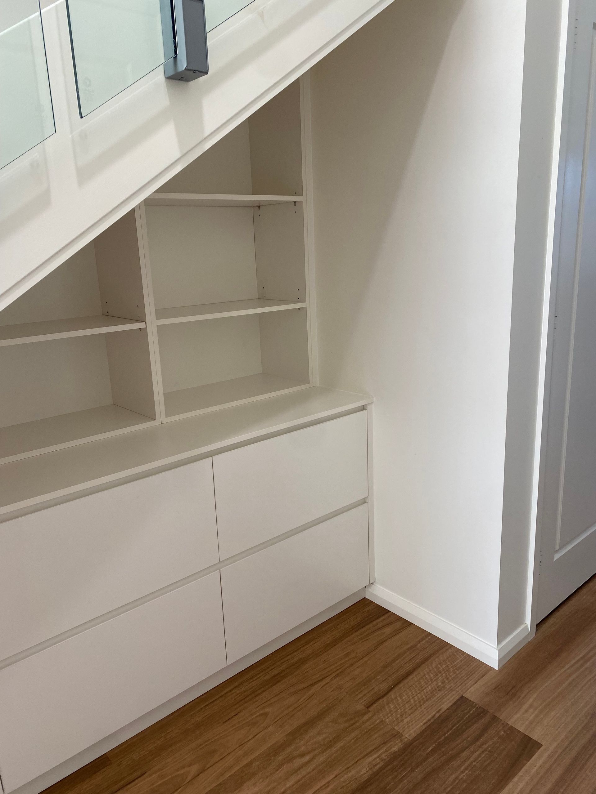 A staircase with a built in shelf underneath it — Coastal Detail Joinery in Tuncurry, NSW