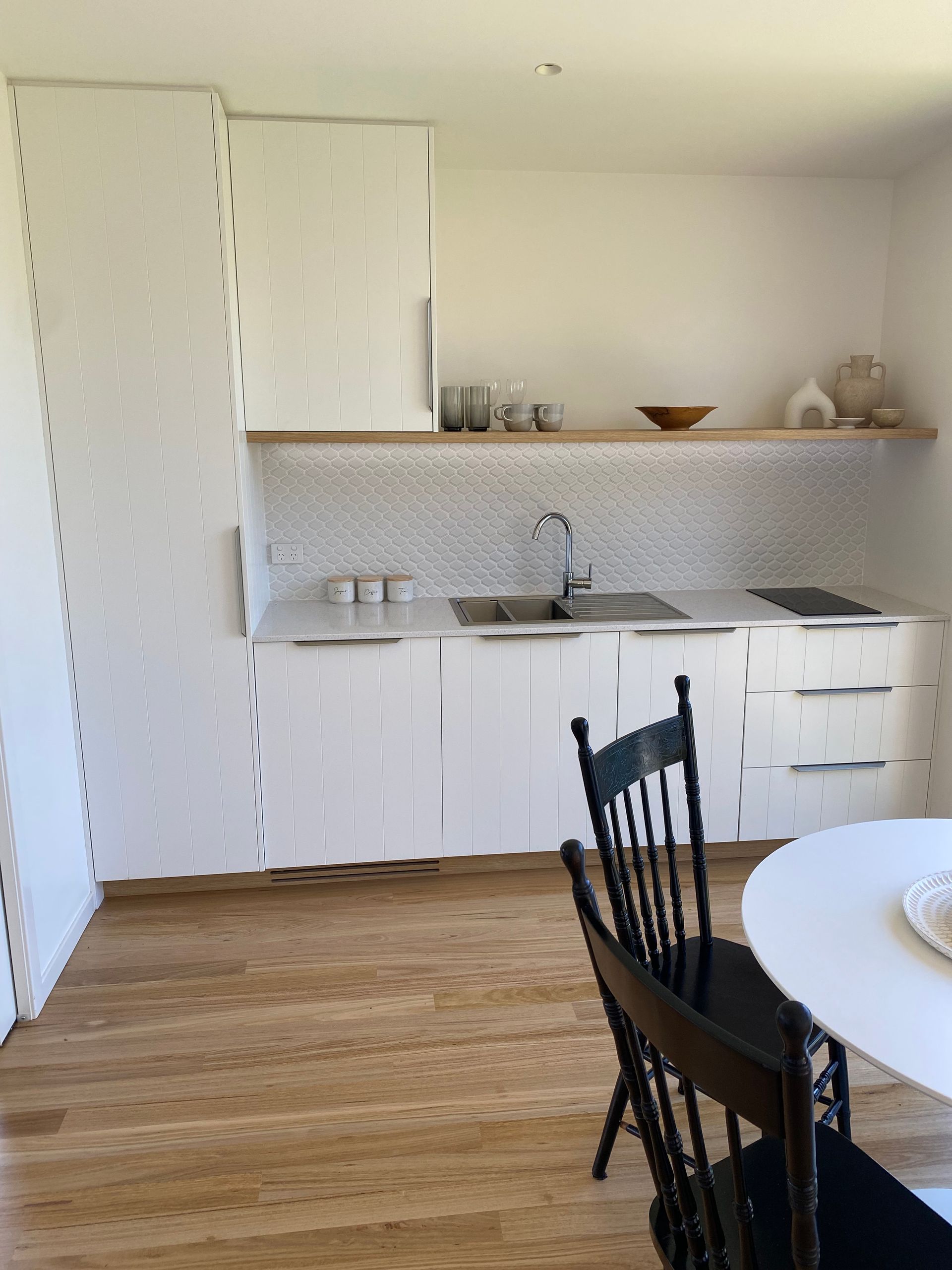 A kitchen with a table, chairs and a sink — Coastal Detail Joinery in Tuncurry, NSW