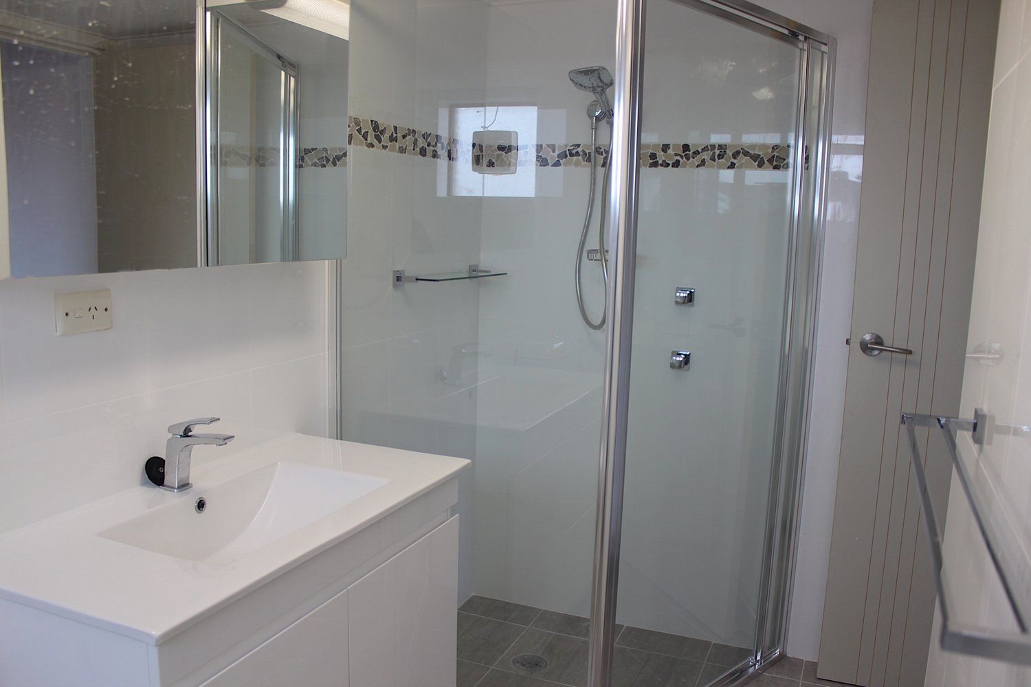 A Bathroom With a Sink and a Walk in Shower — Coastal Detail Joinery in Tuncurry, NSW
