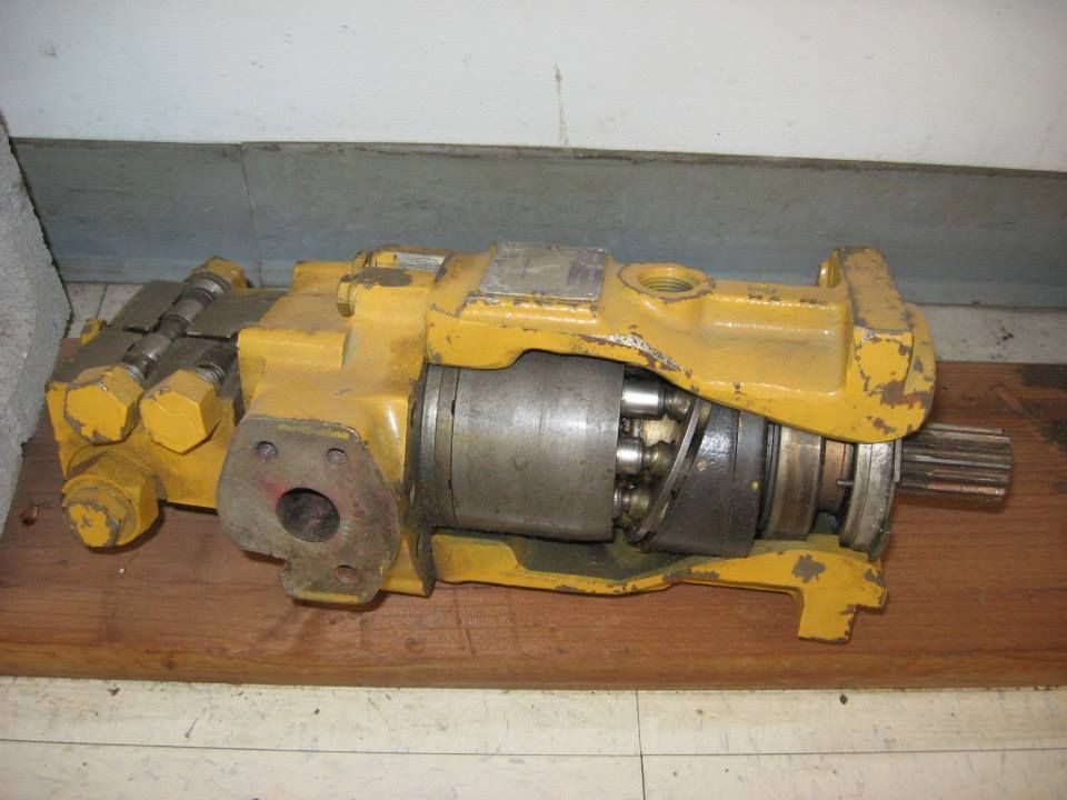 a yellow machine is sitting on a wooden table