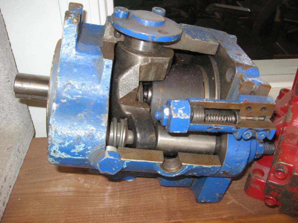 a blue and red machine is sitting on a wooden table