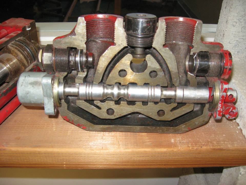 a piece of metal is cut in half on a wooden table