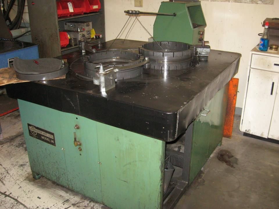a green and black table with a machine on it