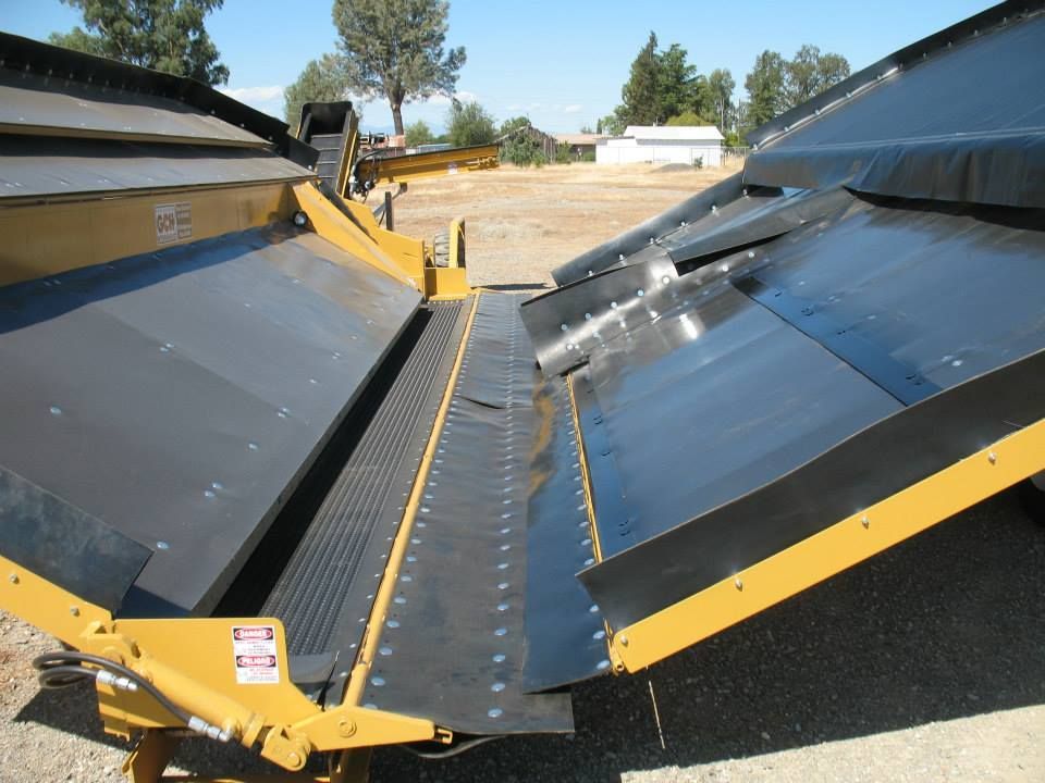 a harvester set with a warning sign on it