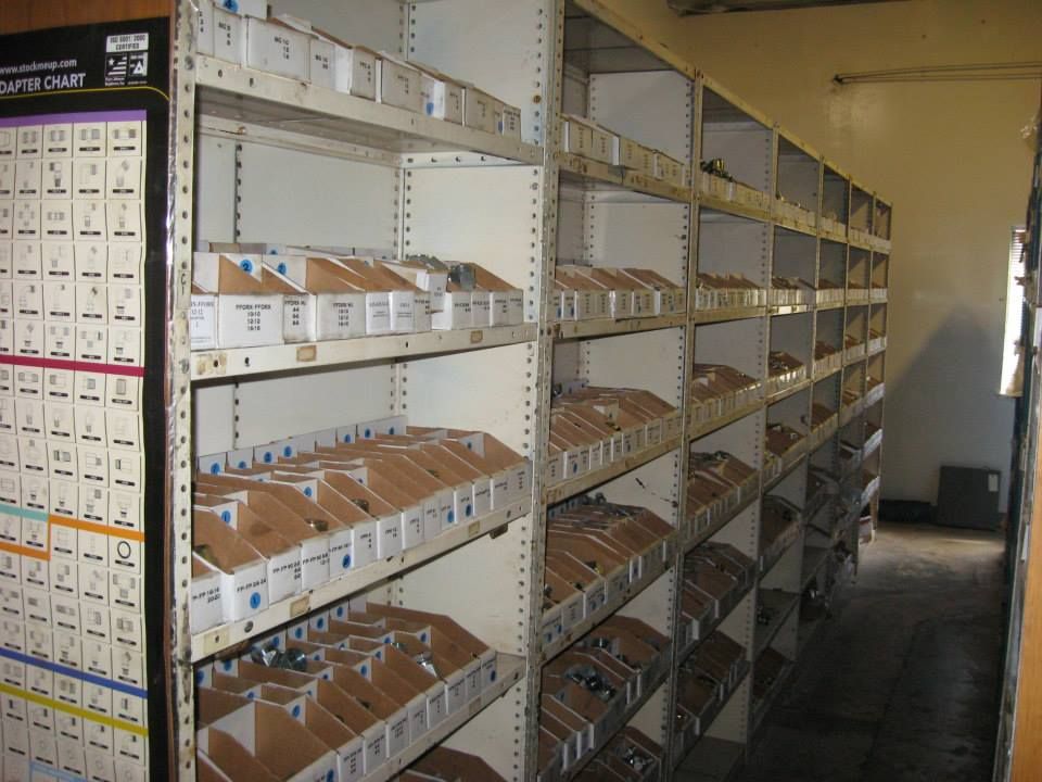 a row of shelves filled with boxes of various sizes