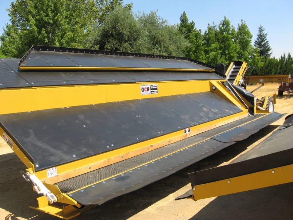 a harvester set with a warning sign on it